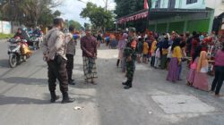 Babinsa Pagutan Timur dan Bhabinkamtibmas Polsek Pagutan Jamin Keamanan dan Kelancaran Jalannya Tradisi dan Budaya Praja